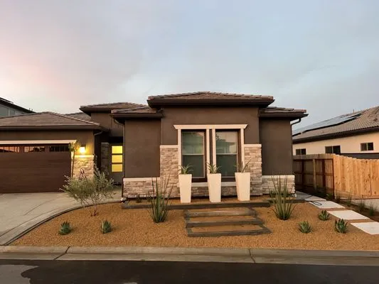 Manuel Landscaping Logo