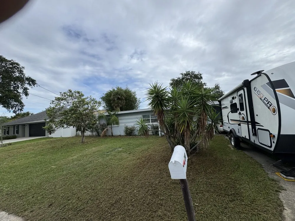 Professional yard cleanup service for homes in Titusville, FL by Marcus & Sons Landscaping