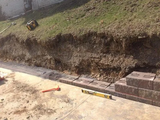 Marich Landscaping & Excavating Logo