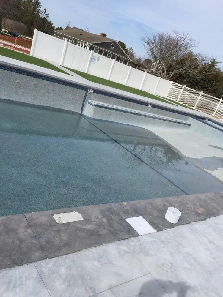 Local landscape design with custom design in Hyannis, MA by Marichal Swimming Pool Construction