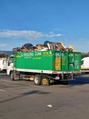 Mario G. Hauling Junk Removal Logo
