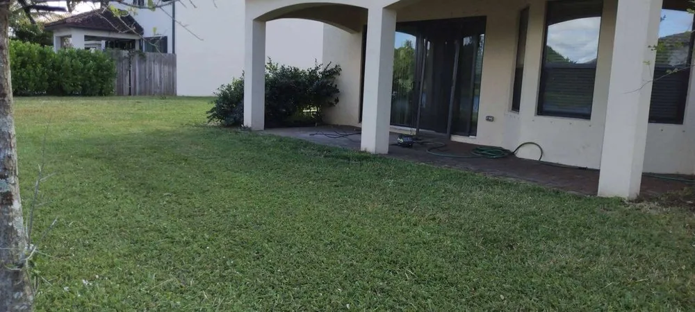 Professional outdoor landscaping for homes in Riviera Beach, FL by Mario Perez