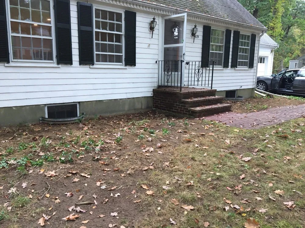 Professional yard cleanup service for year-round maintenance in Waltham, MA by Marquense Landscaping