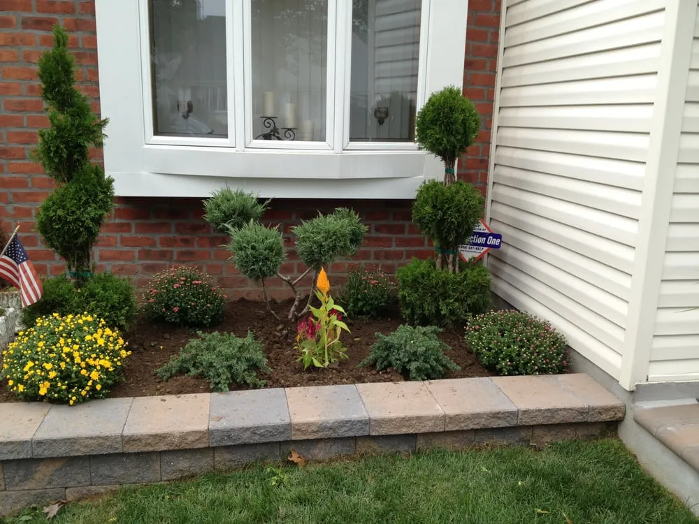 Professional landscape installation for year-round maintenance in Melville, NY by Marra Landscaping
