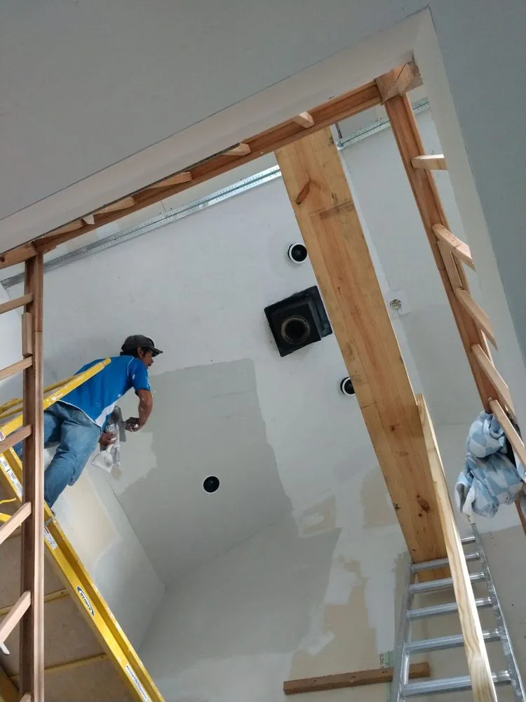 Custom landscape installation with custom design in Monon, IN by Marroquin Renovations & Services