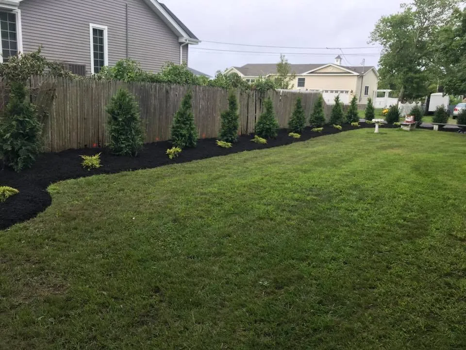 Professional landscape installation for residential properties in Sayville, NY by Martin Landscaping