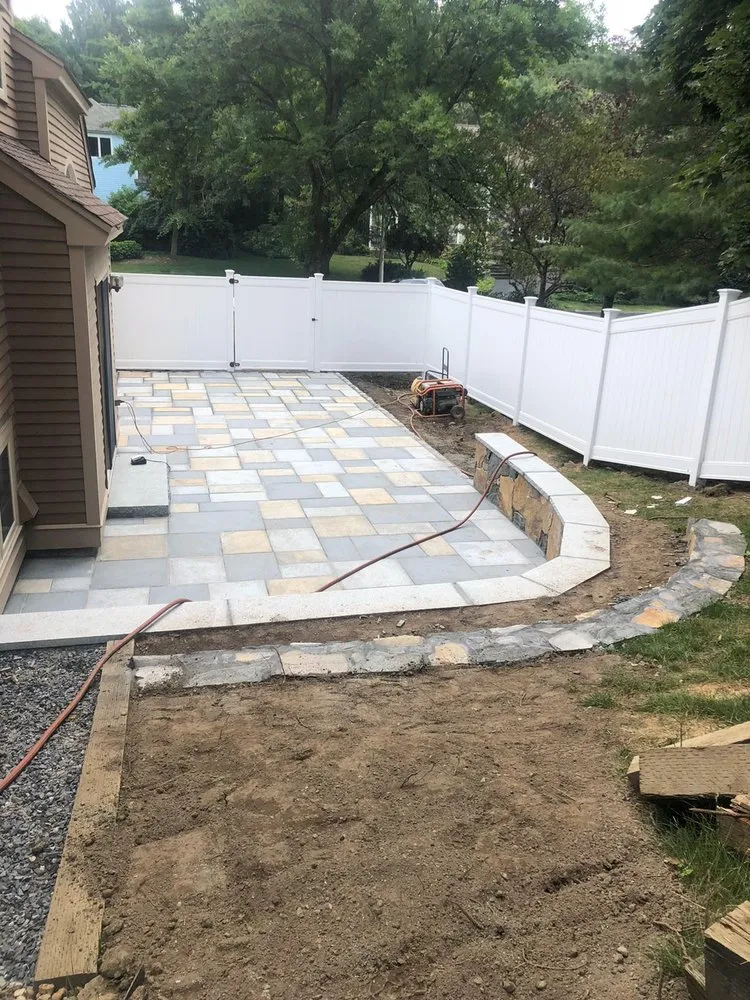 Professional outdoor landscaping for homes in Medford, MA by Masonry Mass