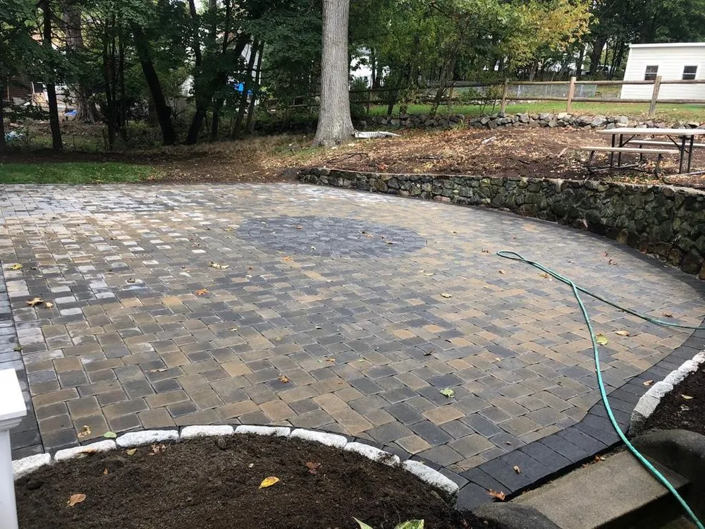 Affordable lawn care service with custom design across Medford, MA - Masonry Mass