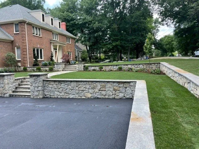 Local yard cleanup service for homes in Whitinsville, MA by Mass Landscapes