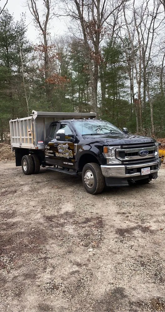 Affordable outdoor landscaping for year-round maintenance in Quincy, MA by Mass Lawn Pros