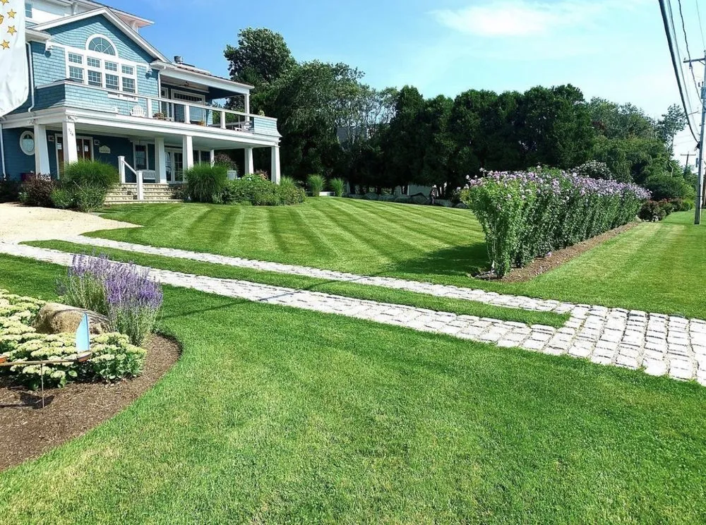 Expert lawn mowing service for homes in Wakefield, RI by Masson Landscaping