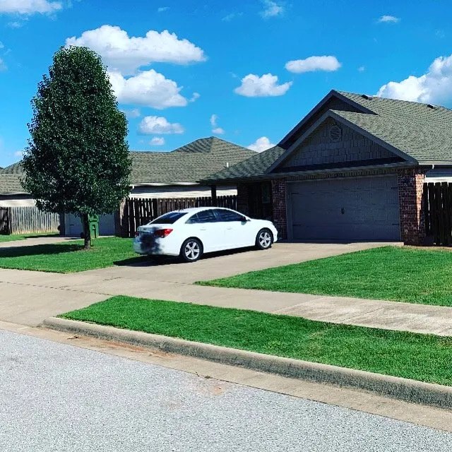 Expert lawn mowing service for residential properties in Rogers, AR by Maverick Landscapes