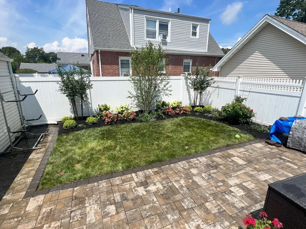 Custom outdoor landscaping for beautiful yards in Westbury, NY by McCutchan Landscaping & Irrigation