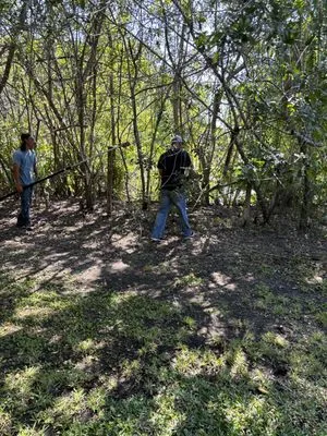 Mcgee landscape and junk removal Logo