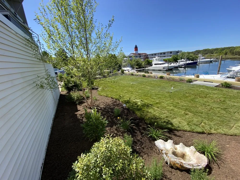 Custom lawn mowing service for year-round maintenance in South Yarmouth, MA by McGrath Landscape Contractors