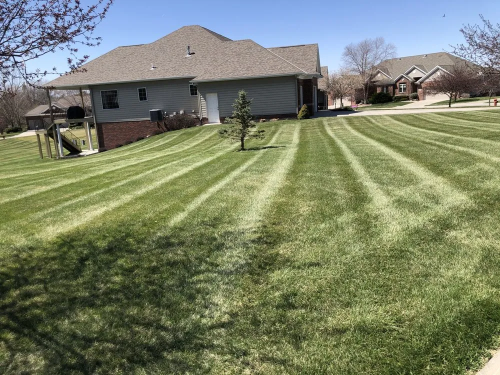 Local lawn mowing service for year-round maintenance in Omaha, NE by Mckinnon Lawn & Scapes