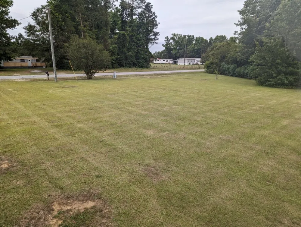 Expert lawn mowing service for year-round maintenance in Garland, NC by Mclamb Lawn Care