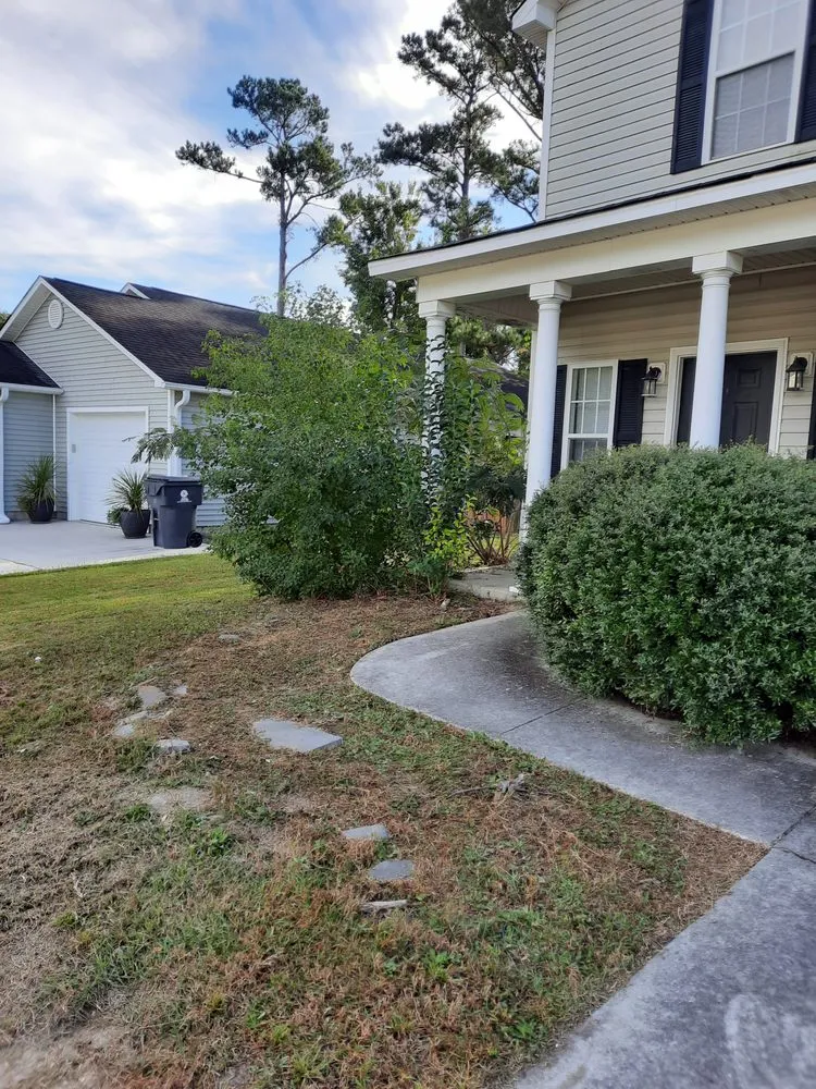 Professional landscape installation with custom design across Leland, NC - McMahan Property Management