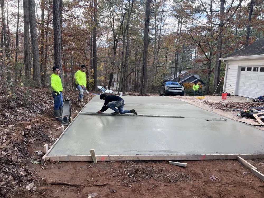 Professional landscape installation with custom design in Powder Springs, GA by Medina Concrete