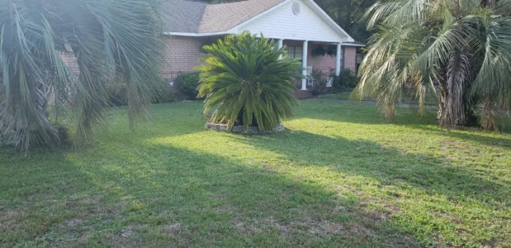 Custom landscape installation with custom design in Pensacola, FL by Melanies Lawncare Services