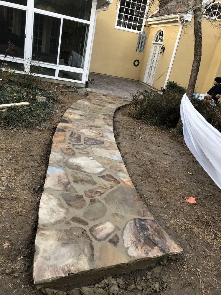 Expert lawn care service for year-round maintenance across Flowery Branch, GA - Men in Black Landscape and Hardscape Outdoor Solutions