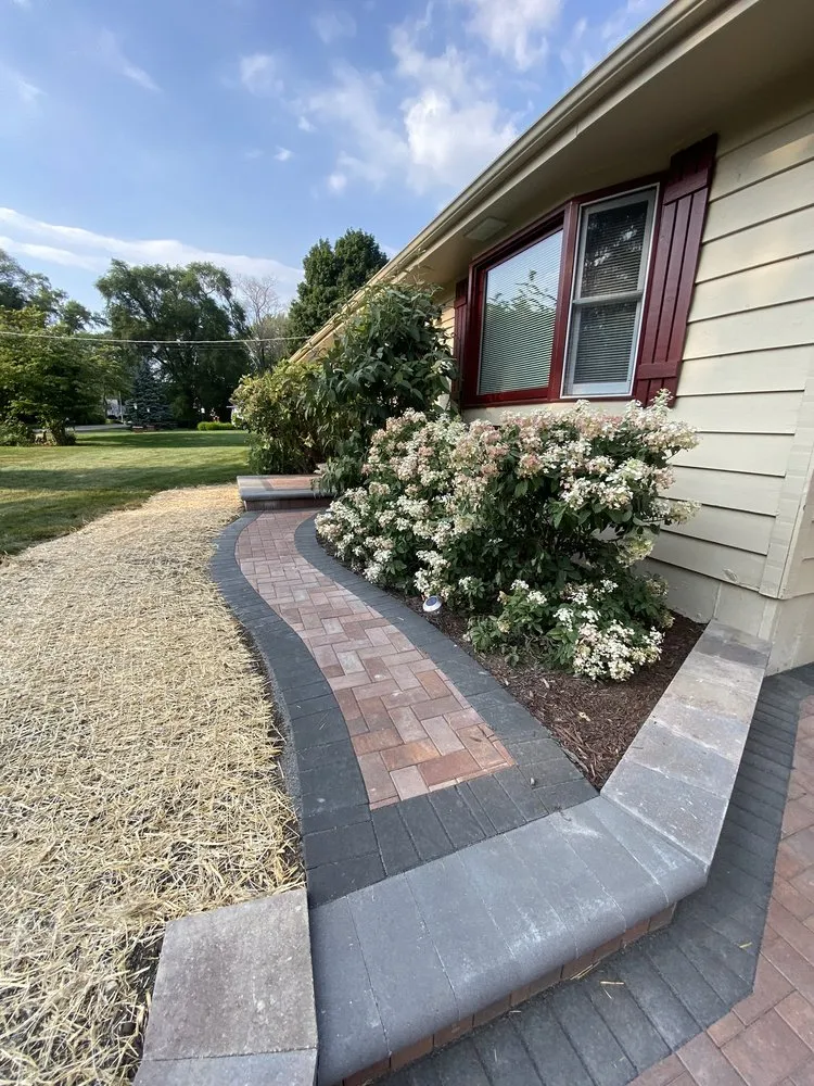 Expert lawn mowing service for residential properties in Woodstock, IL by Mendez Landscaping & Brick Pavers