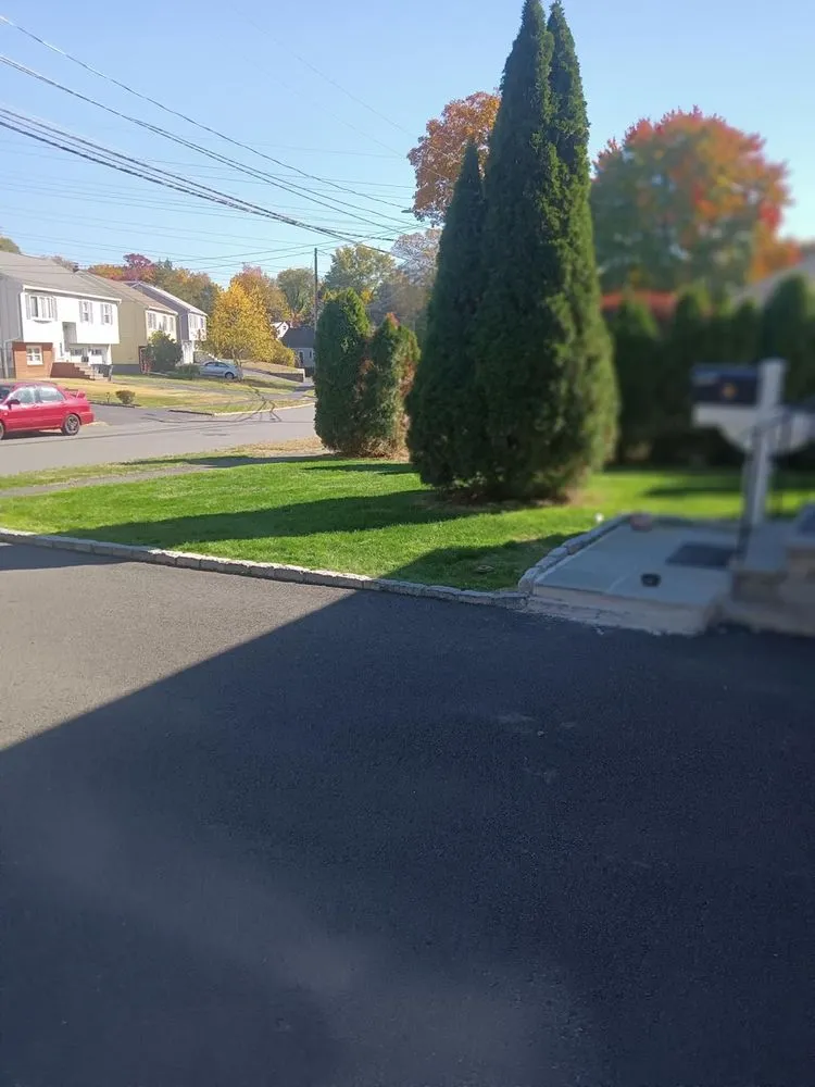 Top-rated lawn mowing service with custom design across Norwalk, CT - Mendez Lawn Care and Tick Control