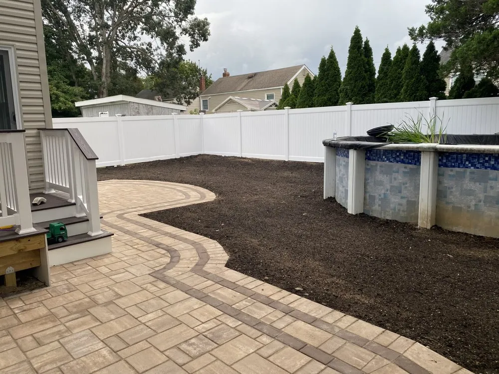 Custom outdoor landscaping with custom design across Deer Park, NY - Mendoza Landscaping