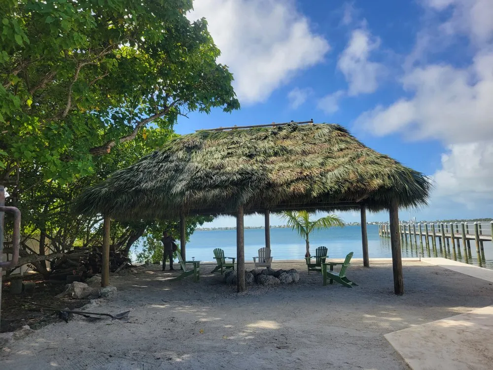 Expert yard maintenance in Homestead, FL by Menjivar Landscape Tiki Hut