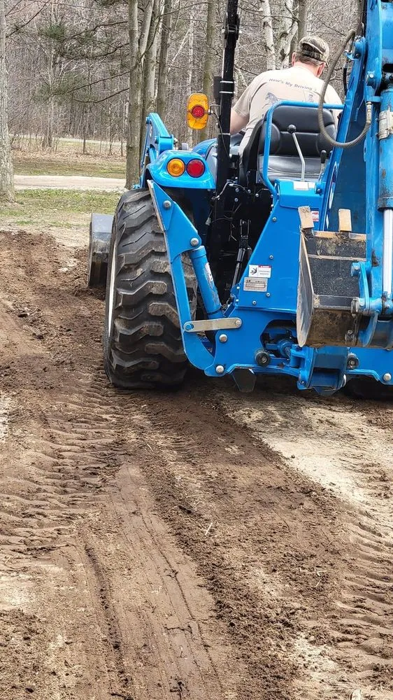Custom outdoor landscaping for beautiful yards in Midland, MI by MI Tractor Guy
