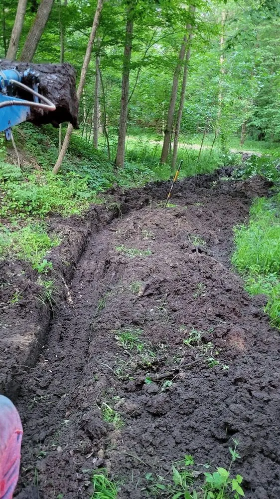 Custom yard cleanup service for year-round maintenance across Midland, MI - MI Tractor Guy