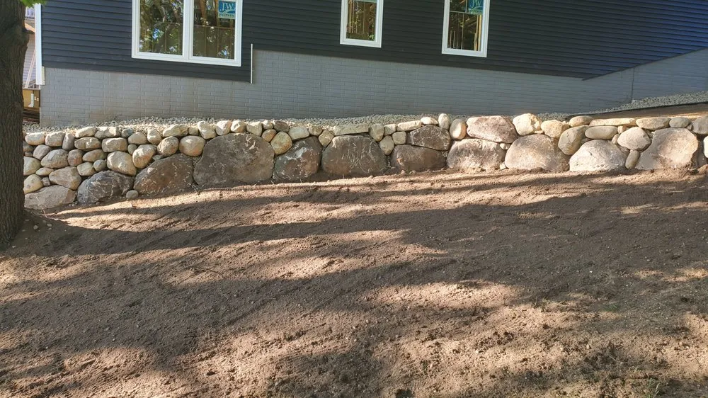 Reliable yard cleanup service with custom design in Union, MI by Michiana Boulders lawn care & Landscaping