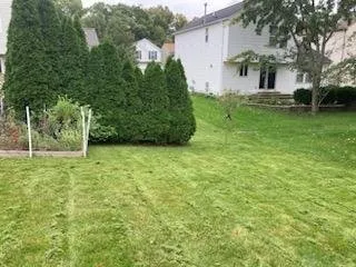 Professional yard maintenance experts serving Burton, MI - Midwest Home Improvements and Seasonal Services