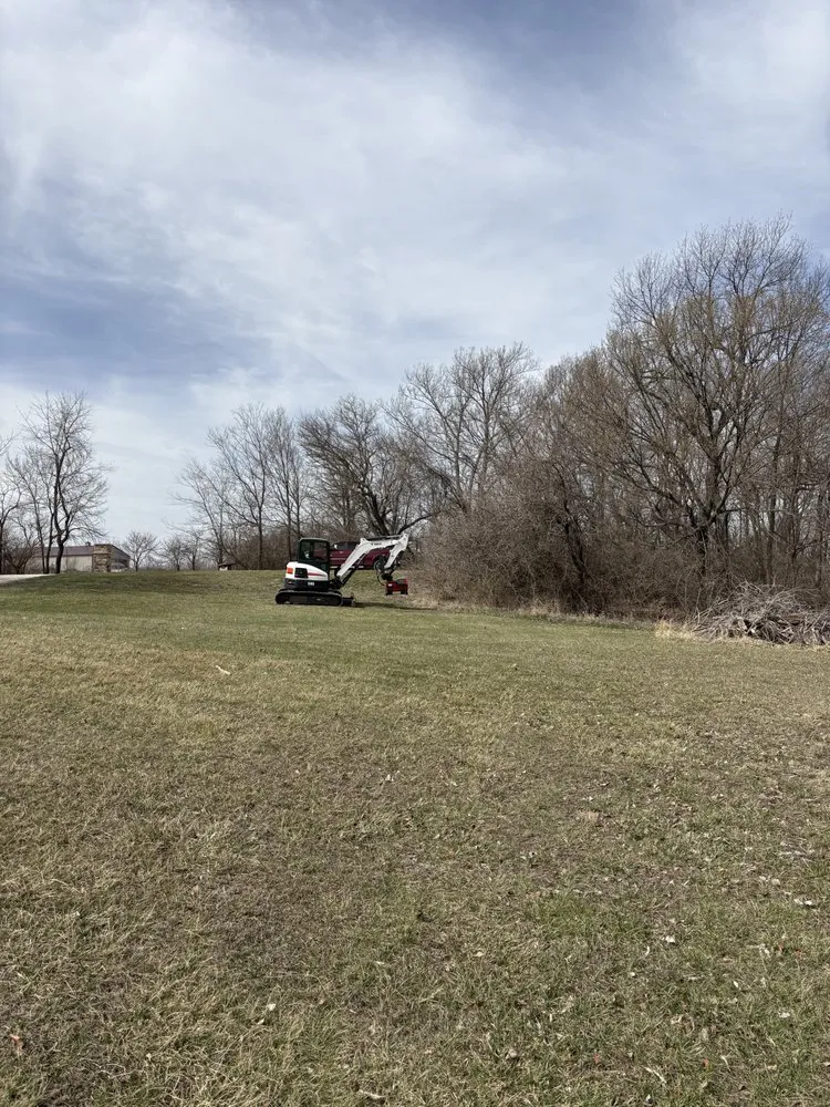 Professional yard maintenance with custom design in Overland Park, KS by Midwest Land And Property Solutions