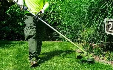 Affordable lawn mowing service with custom design across Dubuque, IA - Midwest Maintenance
