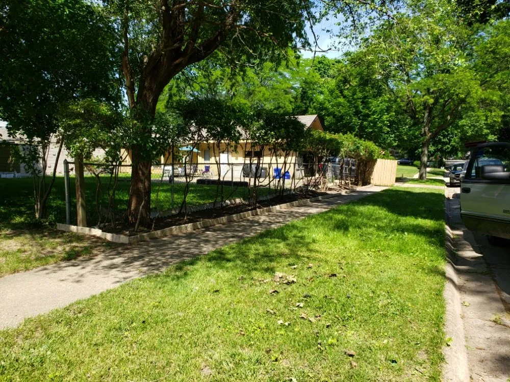 Custom outdoor landscaping with custom design in Rockford, IL by Mike & Son's Property Maintenance