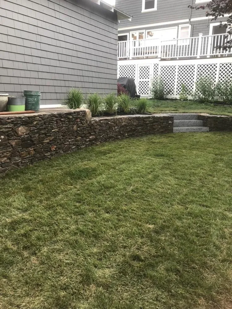 Expert lawn care service for homes in Boston, MA by Millenium Fence Construction & Landscaping