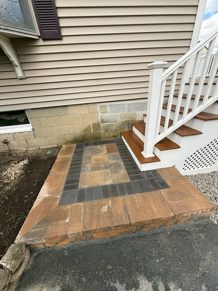 Professional yard cleanup service for residential properties in Canton, MA by Millennium Landscape and Design