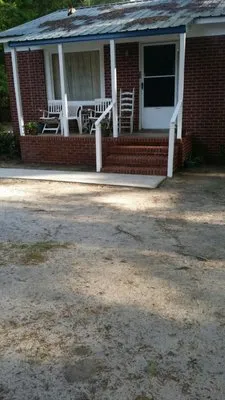 Miller And Polite Pressure Washing And Landscaping Logo