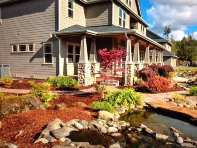 Professional lawn mowing service for year-round maintenance in Belfair, WA by Millions Custom Landscaping