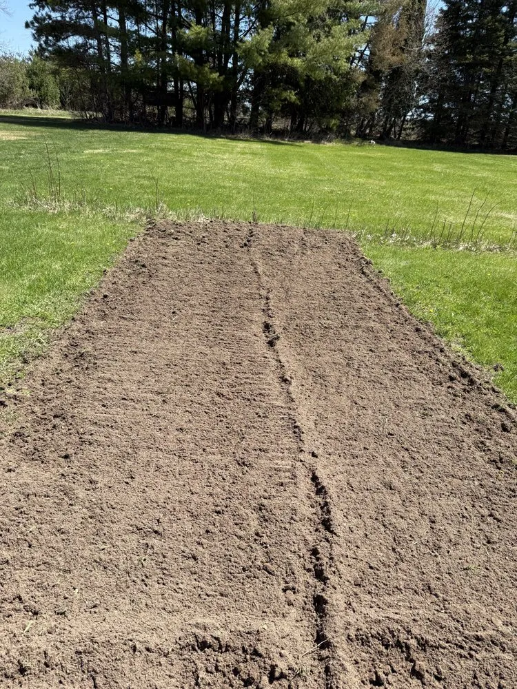 Professional lawn care service in Manistique, MI by Mini Earthworks