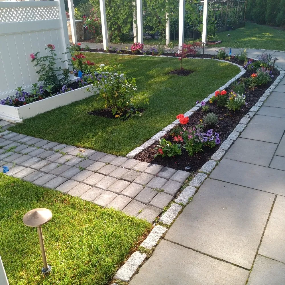Expert yard cleanup service for year-round maintenance in Waltham, MA by Miranda Landscaping Maintenance