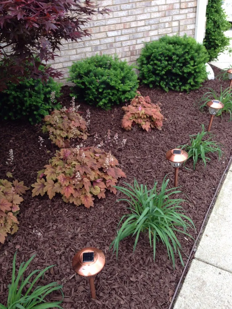 Custom landscape design in Nicholasville, KY by Miss Mow It All