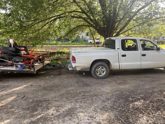 Mitchum’s Lawn Care an Tree Trimming Logo