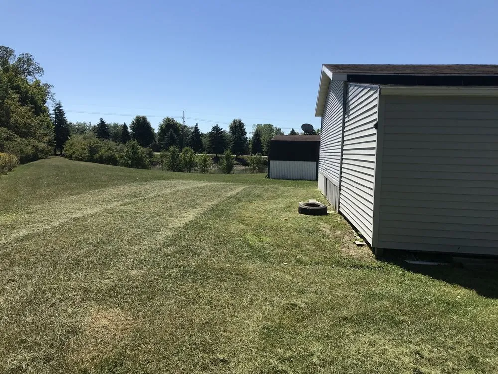 Custom outdoor landscaping with custom design in Newport, MI by M&M Lawn Care and Snow Removal