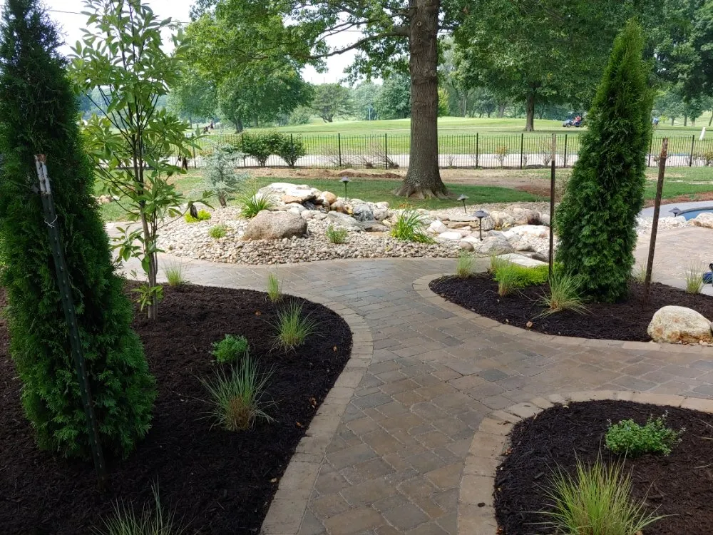 Expert yard maintenance for residential properties in Lenexa, KS by Modern Marvels