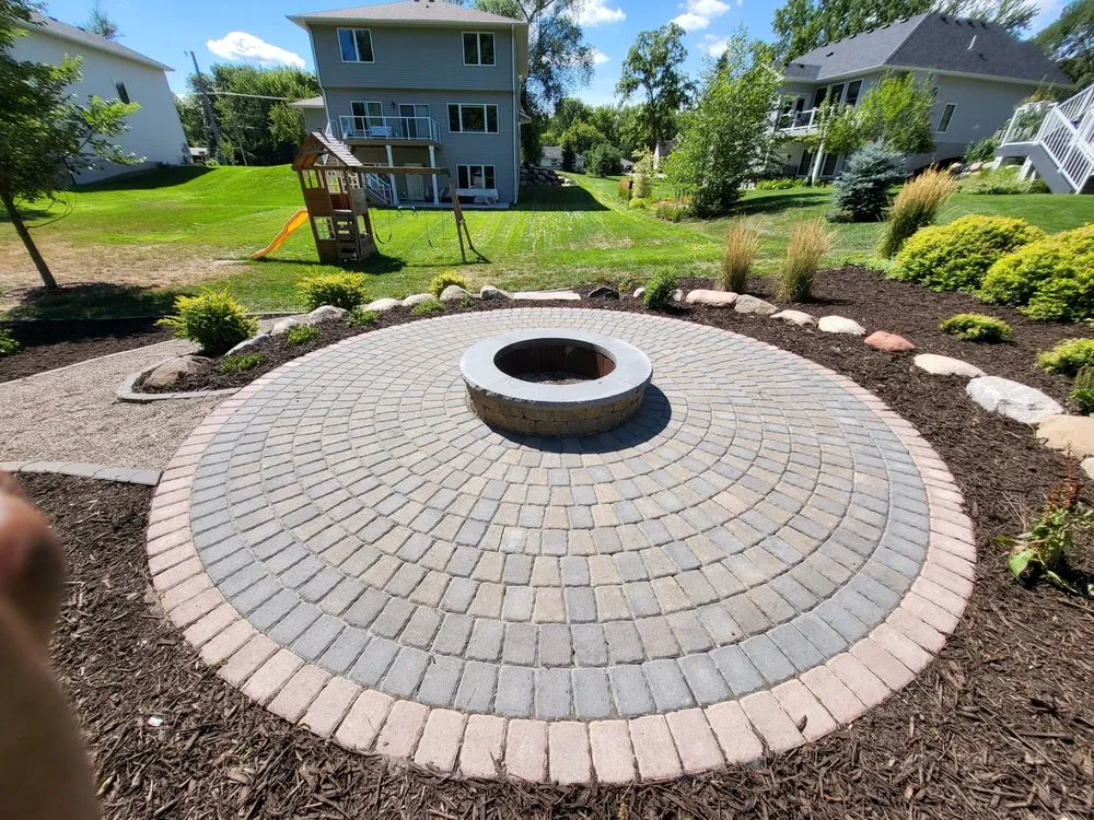 Custom landscape installation for year-round maintenance in Saint Paul, MN by Monarch Landscaping