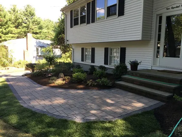 Custom lawn care service for residential properties in Framingham, MA by Monteiro And Sons Landscape Services