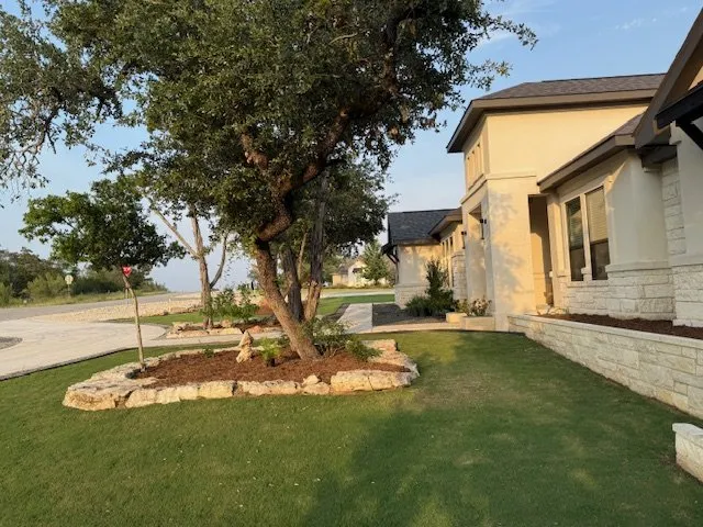 Affordable yard cleanup service for year-round maintenance in New Braunfels, TX by Moochie's Design and Landscaping