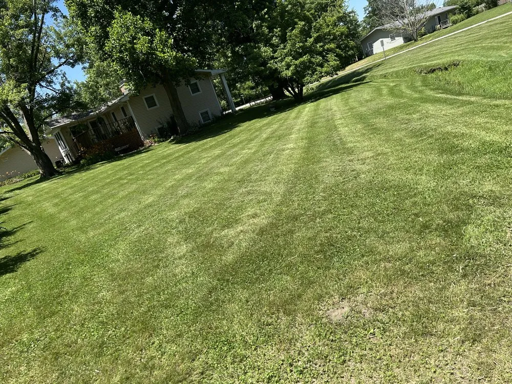 Affordable lawn mowing service for year-round maintenance across Hallsville, MO - Morris Lawn & Farm